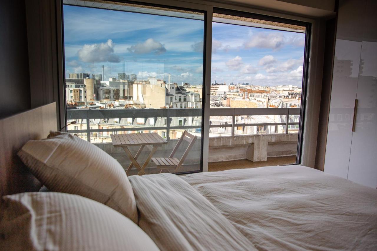 Appartement Vue Tour Eiffel Parigi Esterno foto